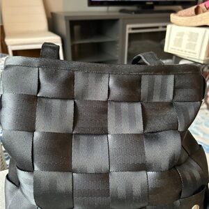Harverys Mercedes Benz seat belt can be a tote or a pocketbook. Designer black